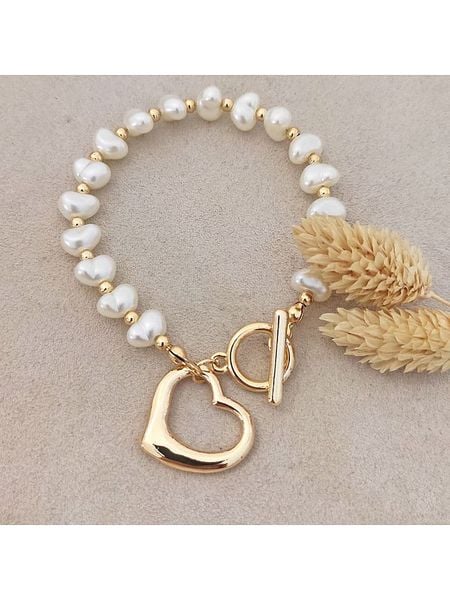 Nakkash Pozłacana bransoletka rozmiar: onesize. Żółte bransoletki Nakkash, z perłą, pozłacane. Za 52.55 zł.