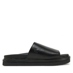 Klapki Calvin Klein Jeans. Czarne klapki Calvin Klein Jeans, bez wzorów, z jeansu, bez obcasa, bez zapięcia. Za 439.99 zł.