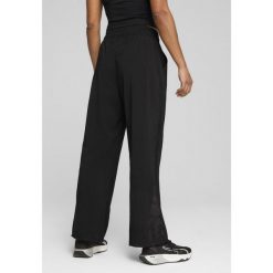 Damskie spodnie LACE PUMA Black. Czarne spodnie sportowe Puma, bez wzorów, na fitness i siłownię. Za 269.00 zł.