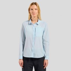 Koszula z długim rękawem damska ODLO Shirt l/s ESSENTIAL. Niebieskie koszule ODLO, l, bez wzorów, z materiału, klasyczne, bez kołnierzyka, bez ramiączek. Za 409.99 zł.