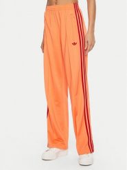 Adidas Spodnie dresowe adicolor Classic Firebird JP2309 Pomarańczowy Loose Fit. Brązowe spodnie dresowe adidas, bez wzorów, z dresówki. Za 259.99 zł.