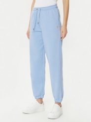 Guess Spodnie dresowe W4YB33 KC811 Niebieski Regular Fit. Niebieskie spodnie dresowe Guess, z aplikacjami, z dresówki. Za 229.99 zł.