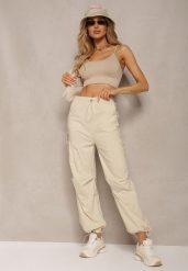 Jasnobeżowe Szerokie Spodnie High Waist w Stylu Bojówek Wykończone Gumką w Talii Ellcara. Brązowe jeansy Renee, m, bez wzorów, z jeansu, eleganckie, z podwyższonym stanem. W wyprzedaży za 63.99 zł.