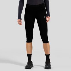 Legginsy 3/4 do biegania damskie Odlo ESSENTIAL. Czarne legginsy ODLO, bez wzorów, sportowe. Za 332.09 zł.