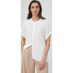 Tommy Hilfiger koszula damska kolor biały relaxed. Białe koszule Tommy Hilfiger, bez wzorów, z tkaniny, bez kołnierzyka, bez ramiączek. W wyprzedaży za 359.99 zł.