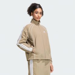 Kultowa bluza dresowa z tkaniny z 3 paskami. Zielone bluzy adidas, xl, bez wzorów, z dresówki, bez ramiączek, bez kaptura. Za 329.00 zł.