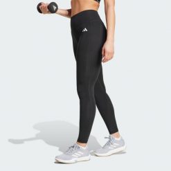 Długie legginsy Optimé Essentials Stash Pocket. Czarne legginsy adidas, bez wzorów, z elastanu, długie. Za 157.99 zł.