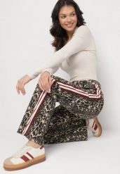 Beżowo-Brązowe Jeansy z Bawełny o Szerokim Kroju Ozdobione Lampasami Eliniae. Brązowe jeansy Born2be, bez wzorów, z bawełny, eleganckie. W wyprzedaży za 110.49 zł.