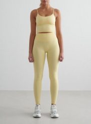 Damskie legginsy bezszwowe, wysoki stan, squat proof petite Shape żółty mellow. Żółte legginsy AIM'N, bez wzorów, z elastanu, street. Za 296.00 zł.