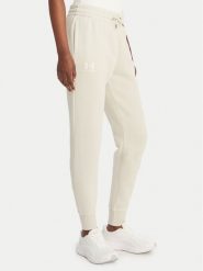 Under Armour Spodnie dresowe UA Icon Fleece 6001537 Beżowy Slim Fit. Brązowe spodnie dresowe Under Armour, bez wzorów, z bawełny. Za 249.99 zł.