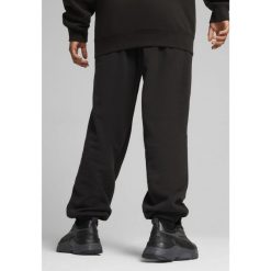 Spodnie dresowe unisex Essentials Elevated PUMA Black. Czarne spodnie sportowe Puma, bez wzorów, z dresówki, trekkingowe. Za 219.00 zł.