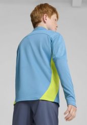 Młodzieżowa bluza treningowa Manchester City F.C. z zamkiem 1/4 PUMA. Niebieskia bluzy Puma, m, bez wzorów, klasyczne, bez ramiączek, bez kaptura. Za 304.50 zł.