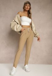 Beżowe Dopasowane Spodnie High Waist z Gumką i Wiązaniem w Talii Zelpia. Brązowe jeansy Renee, bez wzorów, z jeansu, eleganckie, z podwyższonym stanem. W wyprzedaży za 39.99 zł.
