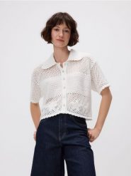 Ażurowa bluzka - kremowy. Białe bluzki Reserved, l, w ażurowe wzory, z bawełny, bez kołnierzyka, bez ramiączek. Za 139.99 zł.