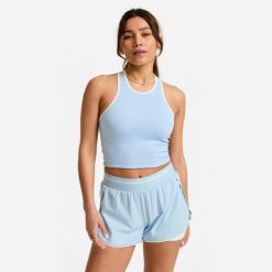 Koszulka fitness damska Domyos bez rękawów. Niebieskie t-shirty sportowe DOMYOS, l, bez wzorów, z materiału, bez ramiączek, na fitness i siłownię. Za 49.99 zł.