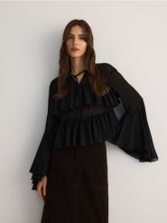 Bluzka z obszernymi rękawami - czarny. Czarne bluzki Reserved, l, bez wzorów, z tkaniny, bez kołnierzyka, bez ramiączek. Za 159.99 zł.