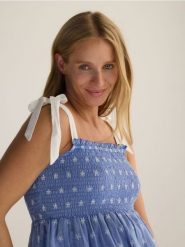 Bluzka na ramiączkach - jasnoniebieski. Niebieskie bluzki Reserved, l, bez wzorów, z bawełny, bez kołnierzyka, bez ramiączek. Za 119.99 zł.