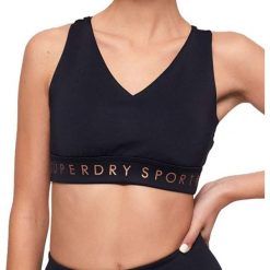 Top sportowy damski Superdry Active Studio. Niebieskie biustonosze sportowe Superdry, bez wzorów, na fitness i siłownię. Za 123.05 zł.
