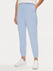 Tommy Jeans Spodnie dresowe Script DW0DW17771 Błękitny Relaxed Fit. Niebieskie spodnie dresowe Tommy Jeans, bez wzorów, z dresówki. Za 249.99 zł.