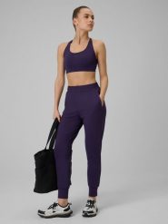 4F Spodnie treningowe szybkoschnące damskie - fioletowe L. Fioletowe spodnie dresowe 4f, bez wzorów. Za 179.99 zł.