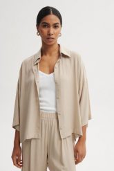 KOSZULA MEL PIASKOWA XL - Flawless. Koszule Flawless, uniwersalny, bez wzorów, z materiału, klasyczne, bez kołnierzyka, bez ramiączek. Za 337.45 zł.