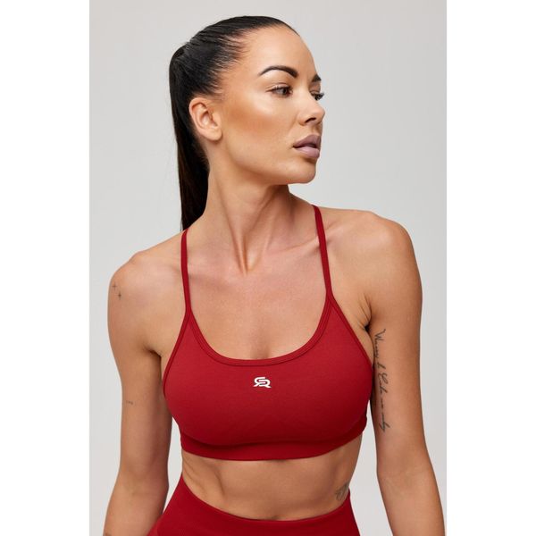 Stanik sportowy bezszwowy Rough Radical Seamless Glow Bra. Czerwone biustonosze sportowe ROUGH RADICAL, bez wzorów, na jogę i pilates. Za 129.90 zł.