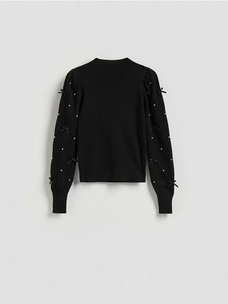 Bluzka z aplikacjami - czarny. Czarne bluzki Reserved, l, z aplikacjami, z dzianiny, bez kołnierzyka, bez ramiączek. Za 129.99 zł.