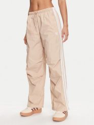 Adidas Spodnie dresowe 3-Stripes Woven Parachute IY7252 Beżowy Loose Fit. Brązowe spodnie dresowe adidas, bez wzorów, z dresówki. Za 219.99 zł.