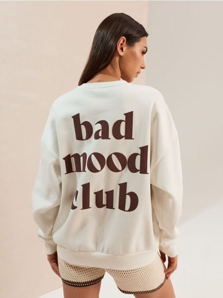 Bluza crewneck z napisem na plecach - kremowy. Białe bluzy Sinsay, l, bez wzorów, bez kaptura. Za 39.99 zł.