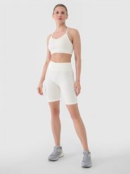 4F Legginsy kolarki bezszwowe treningowe damskie - białe XS/S. Białe legginsy 4f, bez wzorów, z dzianiny, klasyczne, krótkie. W wyprzedaży za 99.99 zł.