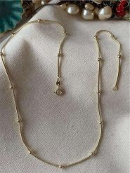 Luseera Pozłacany naszyjnik z elementami ozdobnymi - dł. 45 cm rozmiar: onesize. Żółte naszyjniki Luseera, z materiału, pozłacane. Za 43.99 zł.