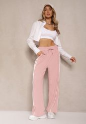 Różowe Szerokie Spodnie Dresowe High Waist Zdobione Lampasami Sopaline. Czerwone jeansy Renee, l, z aplikacjami, z dresówki, eleganckie, z podwyższonym stanem. W wyprzedaży za 47.99 zł.
