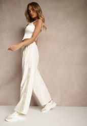 Jasnobeżowe Szerokie Spodnie z Bawełną High Waist Ozdobione Koronką Efandiela. Brązowe jeansy Renee, bez wzorów, z bawełny, eleganckie, z podwyższonym stanem, długie. W wyprzedaży za 41.99 zł.