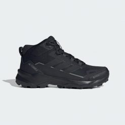 Buty turystyczne Terrex Skychaser AX5 Mid GORE-TEX. Czarne buty do biegania adidas, bez wzorów, z gore-texu, bez zapięcia, do biegania, gore-tex. Za 599.00 zł.