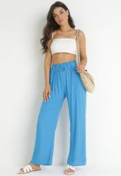 Niebieskie Spodnie Sharrill. Niebieskie jeansy Born2be, l, z aplikacjami, z jeansu, eleganckie, długie. W wyprzedaży za 33.99 zł.