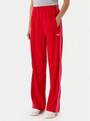 Adidas Spodnie dresowe adicolor Classic Firebird JW1225 Czerwony Loose Fit. Czerwone spodnie dresowe adidas, bez wzorów, z dresówki. Za 299.99 zł.