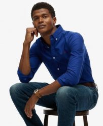 Superdry Klasyczna koszula Oxford z długim rękawem z bawełny organicznej. Niebieskie koszule Superdry, l, bez wzorów, z bawełny, klasyczne, bez kołnierzyka, bez ramiączek. Za 314.00 zł.
