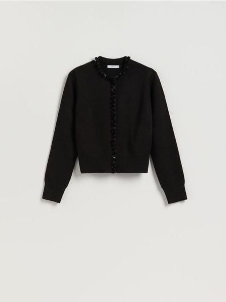 Kardigan z ozdobnym wykończeniem - czarny. Czarne swetry Reserved, l, bez wzorów, z dzianiny, bez ramiączek. Za 139.99 zł.