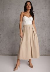 Beżowa Bawełniana Spódnica o Rozkloszowanym Kroju z Plisami Nerimara. Brązowe spódnice Renee, na co dzień, l, bez wzorów, z bawełny, casualowe, midi, proste. Za 119.99 zł.