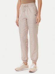 Guess Spodnie dresowe V5YB14 WHFU0 Beżowy Regular Fit. Brązowe spodnie dresowe Guess, z aplikacjami, z dresówki. Za 349.99 zł.