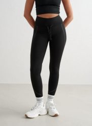Damskie legginsy, wysoki stan, odprowadzające pot, odblaskowe, ocieplane czarne. Czarne legginsy AIM'N, bez wzorów, z elastanu, długie. Za 247.65 zł.