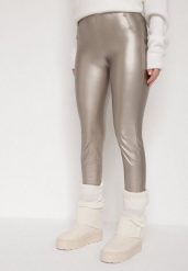 Szampańskie Legginsy z Ekoskóry z Guzikami Wysokim Stanem i Gumką w Talii Sintheria. Żółte legginsy Born2be, z aplikacjami, z jeansu, eleganckie. Za 29.99 zł.