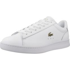 Tenisówki Lacoste Model Carnaby Kolor Biały. Białe trampki Lacoste, bez wzorów, ze skóry, sportowe, bez zapięcia. Za 459.00 zł.