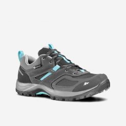 Buty turystyczne damskie Quechua MH100 niskie WTP. Niebieskie buty trekkingowe QUECHUA, z kauczuku, bez zapięcia. Za 229.99 zł.