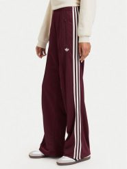Adidas Spodnie dresowe Adicolor Classic Firebird KA7743 Brązowy Loose Fit. Brązowe spodnie dresowe adidas, bez wzorów, z dresówki. Za 299.99 zł.