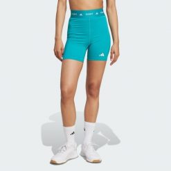 Krótkie legginsy TECHFIT. Niebieskie legginsy adidas, bez wzorów, z materiału, sportowe, krótkie. Za 119.00 zł.