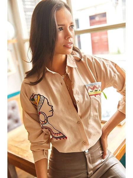 Trendyol Bluzka w kolorze beżowym rozmiar: L. Brązowe bluzki Trendyol, l, z aplikacjami, z bawełny, bez kołnierzyka, bez ramiączek. Za 87.40 zł.