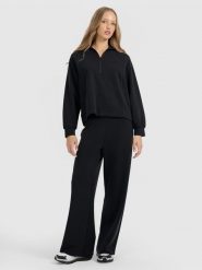 4F Spodnie dresowe z szerokimi nogawkami z modalem damskie - czarne XL. Czarne spodnie dresowe 4f, bez wzorów, z dresówki. Za 189.99 zł.