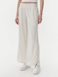 Puma Spodnie dresowe Ess 629804 Beżowy Wide Leg. Brązowe spodnie dresowe Puma, bez wzorów, z dresówki. Za 179.99 zł.