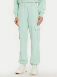Champion Spodnie dresowe 117554 Zielony Loose Fit. Zielone spodnie dresowe Champion, bez wzorów, z bawełny. Za 229.99 zł.